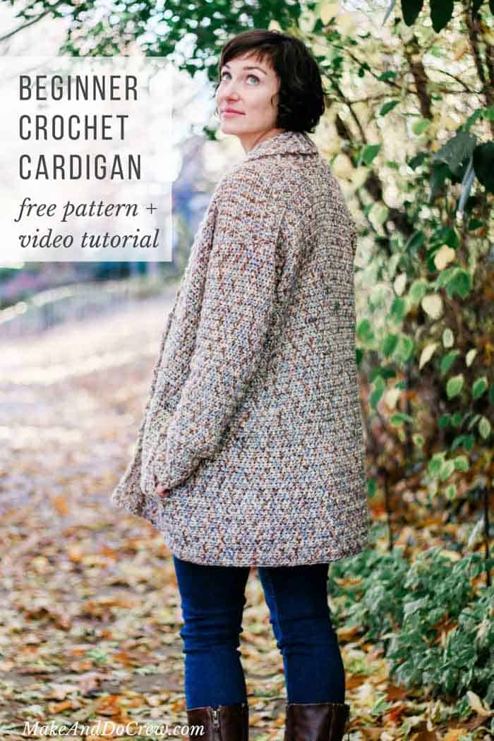 A woman standing outside looking up with her hands on the pockets of a crocheted cardigan with a collar.