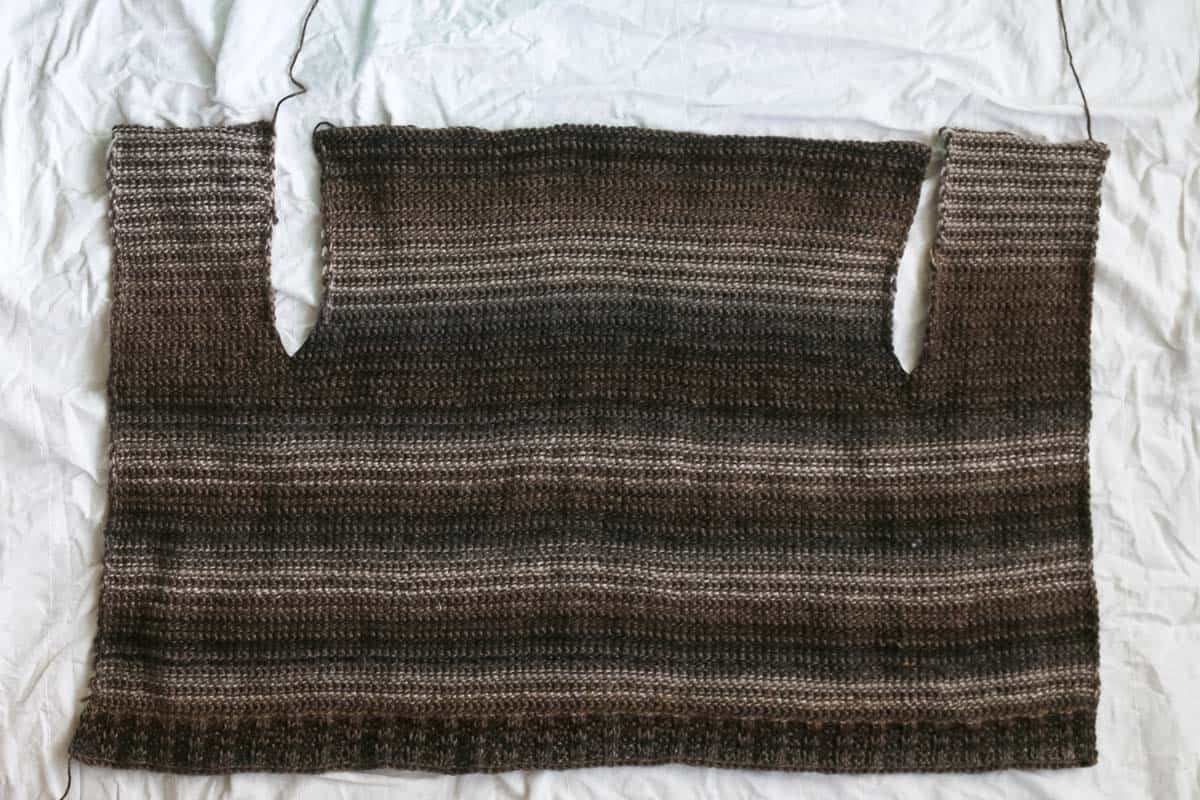 In progress beginner Tunisian crochet cardigan pattern worked in one piece.