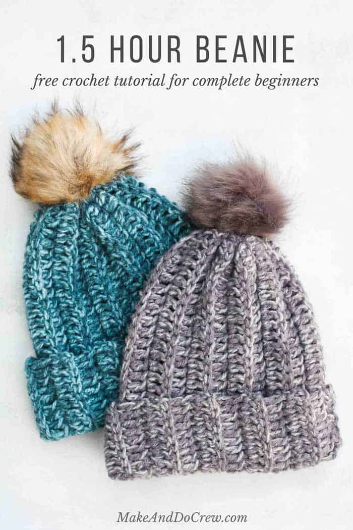 Two solid-colored crochet beanies colored blue and gray with pom poms on a white background.