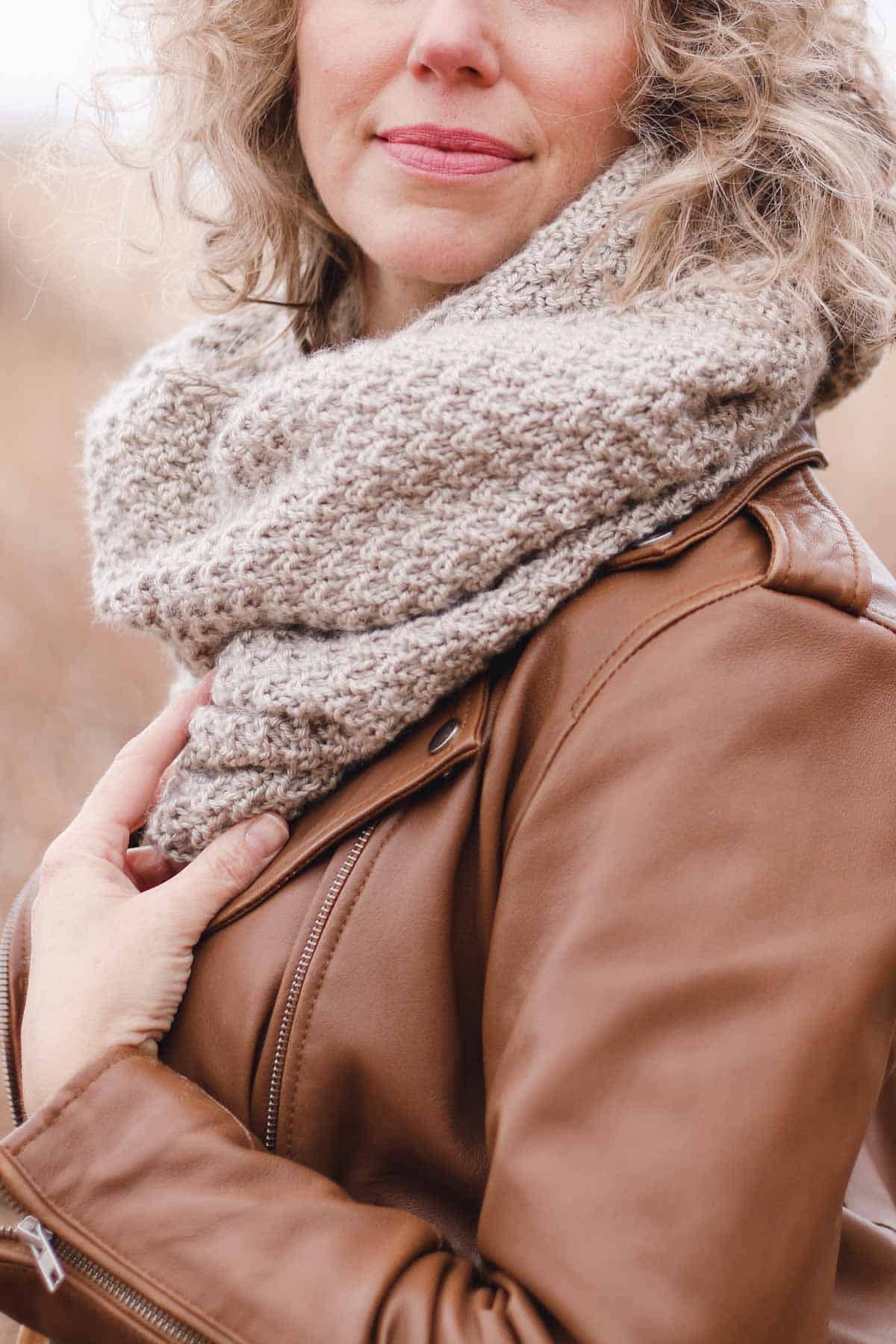 Hand knit infinity scarf modeled by Jess Coppom of Make & Do Crew.